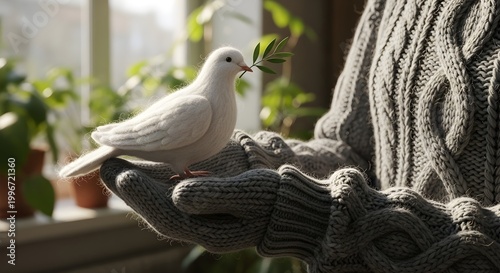 White dove with olive branch rests on persons hand symbol of peace