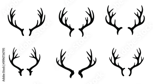 A collection of black antlers arranged in a grid pattern stark silhouette