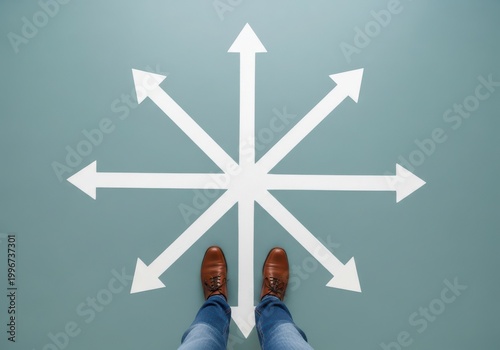 Person standing at the center of multiple directional arrows on a floor