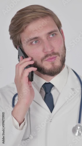 Young Doctor Talking on Phone on White Background, Vertical Video