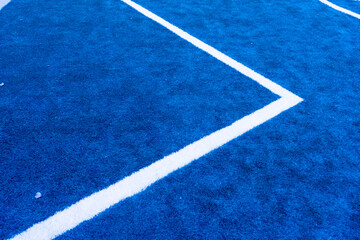 blue artificial grass turf with white line for sports field background texture