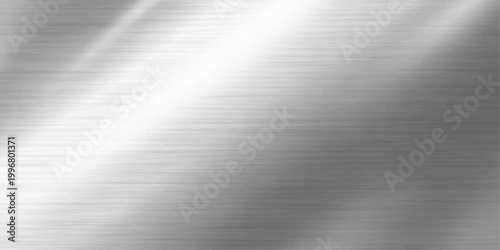 Polished silver stainless steel plate with a brushed metal texture featuring a shiny metallic surface and light gray industrial pattern for a sleek material backdrop