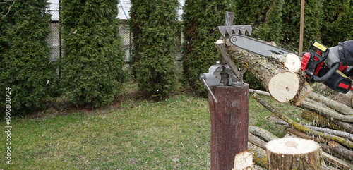 Homemade device for holding logs during sawingcutting woods in logs at home in process, copy space