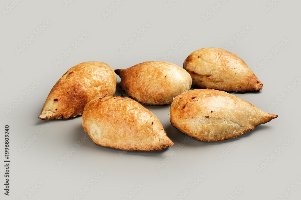 Fototapeta premium Hearty bread items displayed in rustic market setting emphasizing warmth