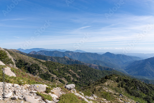 Mountain peaks in Corsican landscape under blue sky
