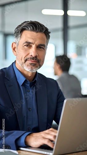 Businessman working on laptop computer.