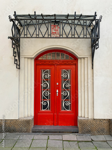 red two-part door with windows in an old house