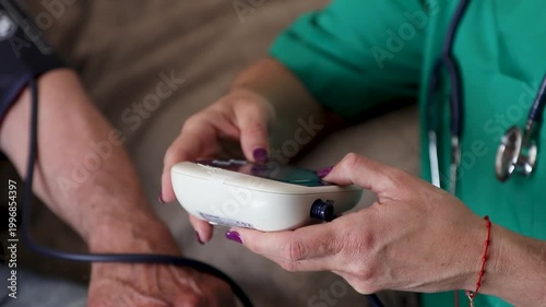 healthcare for the elderly_4k video of a healthcare professional taking the blood pressure of a senior woman