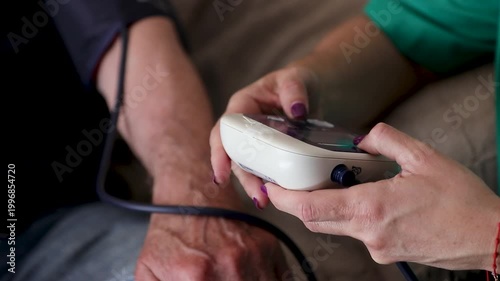 healthcare for the elderly_4k video of a healthcare professional taking the blood pressure of a senior woman
