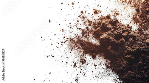 Abstract macro shot revealing brown powder, speckled, contrasted by a black void