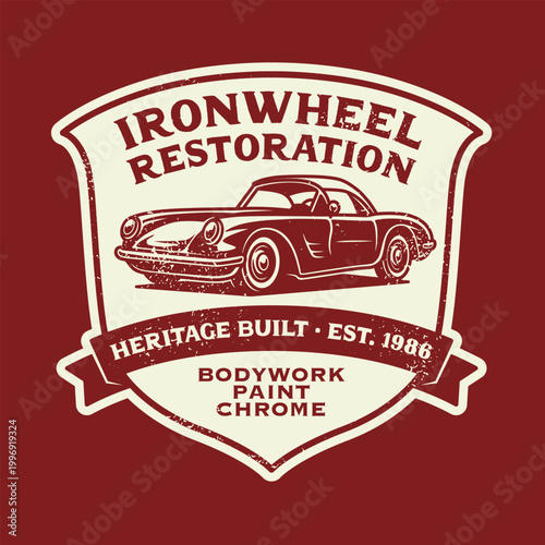 Vintage distressed shield crest badge for classic car restoration with retro sports coupe illustration and bodywork services, cream on dark red. Heritage Built Est. 1986.