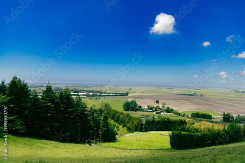 Vast Rural Farmland Under Clear Blue Sky