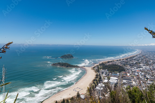 Coastal City Skyline Beside Long Sandy Peninsula