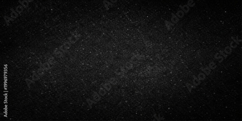 A textured black and white pattern of snow falling down against a dark night sky creates a rough macro background with the appearance of film grain or stars in space