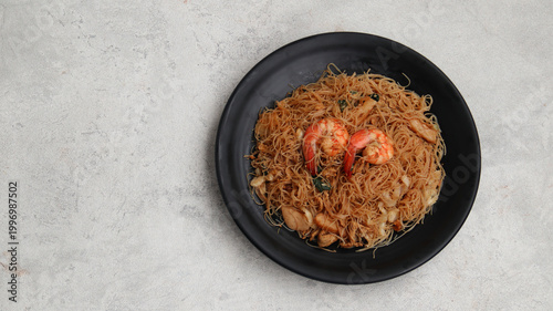 Bihun Goreng or Fried Vermicelli Noodle, traditional Indonesian culinary food	