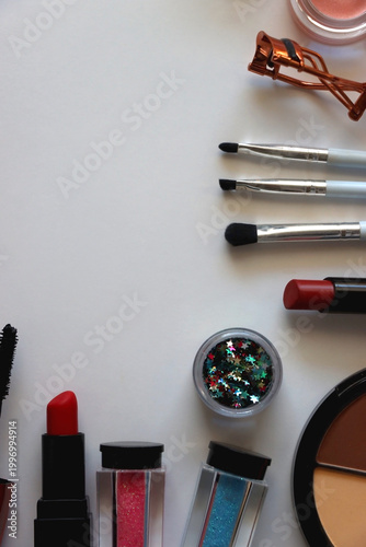 Various colorful cosmetic products on white background. Flat lay.