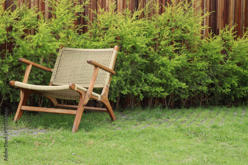 Garden retreat with wooden chair.
