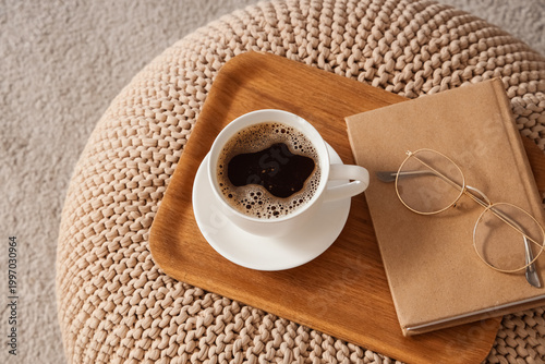 Cup of coffee with book and...