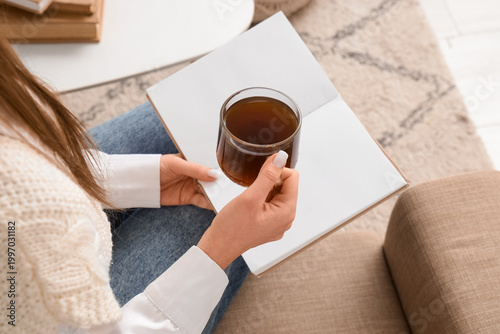 Young woman with cup of cof...