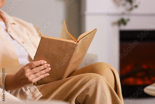 Senior woman reading book n...