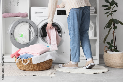 Woman taking towel from was...