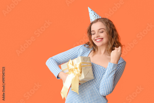 Happy young woman in party ...