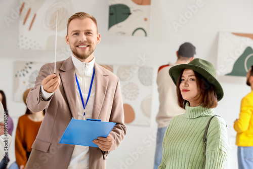 Male guide with people at e...