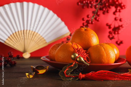 Plate with ripe tangerines ...