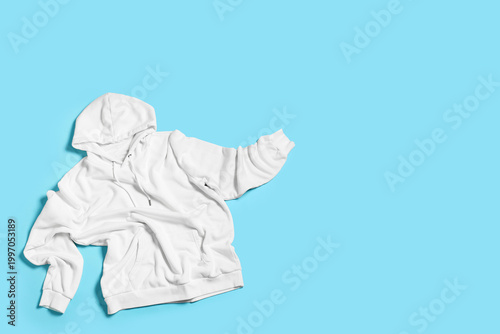 White hoodie on blue backgr...