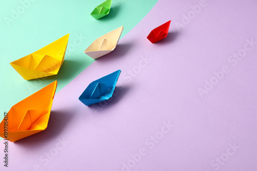 Different paper boats on co...