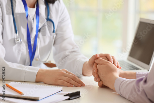 Female doctor and patient h...
