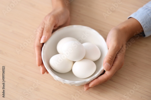Female hands with bowl of b...