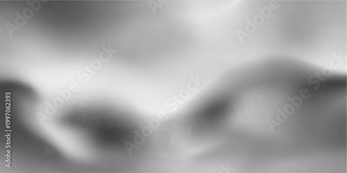 Black and white abstract background featuring a smooth silk wave pattern with a metallic silver texture and a dark smoke fog design illuminated by a subtle gray spotlight