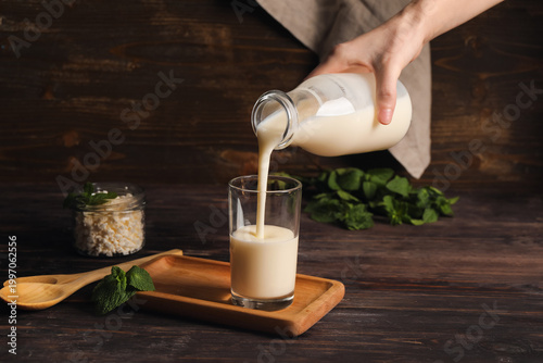 Female hand pouring fresh k...