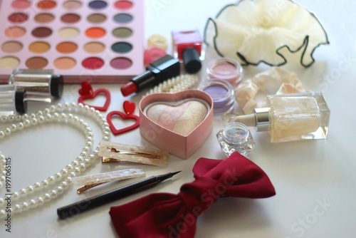 Various accessories and beauty products on white background. Coquette aesthetic. Selective focus.