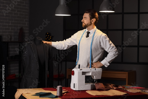 Male tailor with jacket on ...