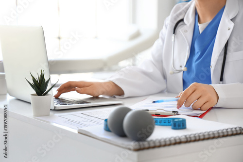 Female doctor working with ...