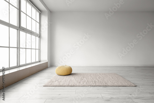 Yellow pouf on carpet in bi...