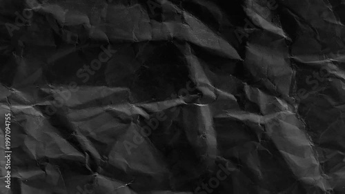 dark crumpled paper texture animated seamless loop grunge wrinkled surface with film grain abstract 4k