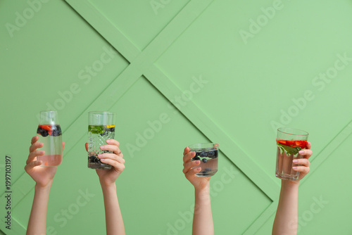 Many hands with infused wat...