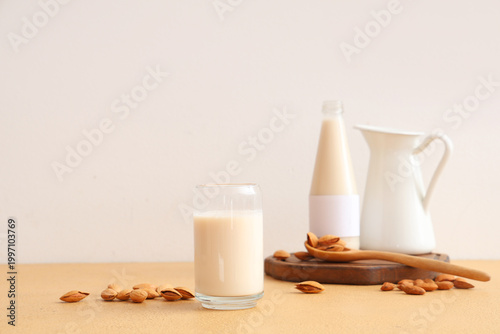 Glass of almond milk with b...