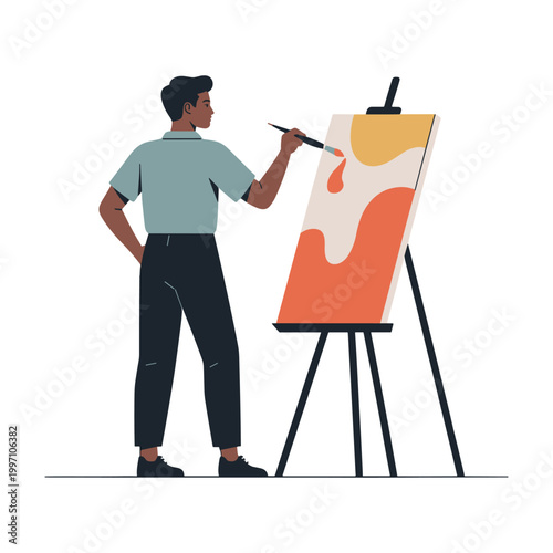 Artist standing before a wooden easel carefully applies vibrant strokes of orange and yellow paint onto a clean canvas to bring a creative vision to life within a bright studio environment today.
