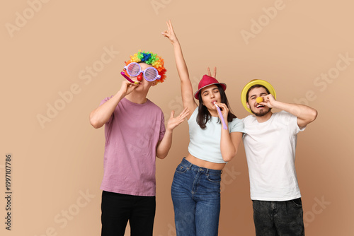 Young friends in funny disg...