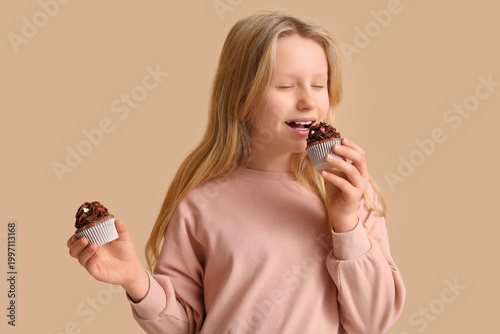 Cute little girl eating tas...