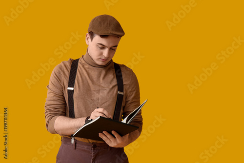 Young writer with notebook ...
