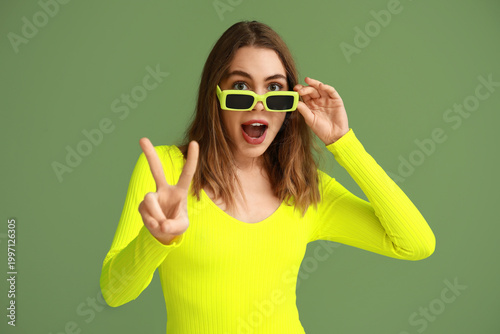 Pretty young woman in sungl...