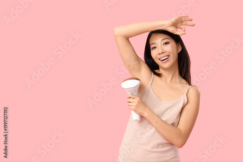 Pretty Asian woman using ph...