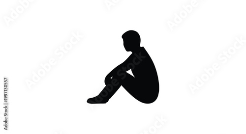A solitary figure seated with knees drawn up a stark black silhouette