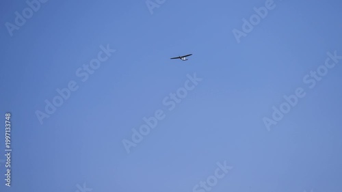 Military ISR Drone Aircraft flying on blue sky background. UAV in flight. Reconnaissance UAV. drone aircraft plane at work. unmanned systems technology applying in military and civilian sector