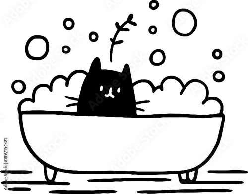 Cat sitting in bubble bath inside freestanding bathtub
